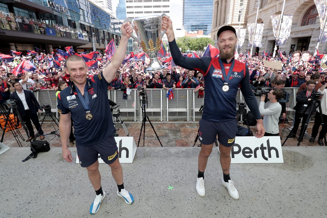 Melbourne coach Simon Goodwin and captain Max Gawn show off the AFL premiership cup in Perth. (Richard Wainwright/AAP PHOTOS)