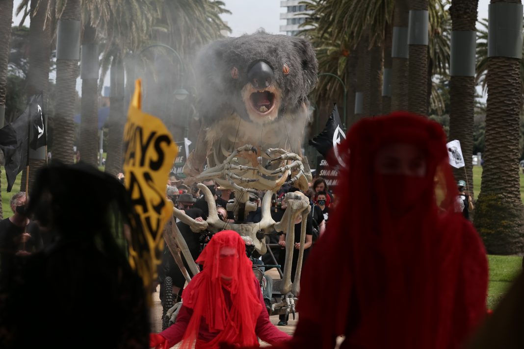 A 4m-tall burning koala has been at the centre of a Melbourne protest against climate change. (Con Chronis/AAP PHOTOS)